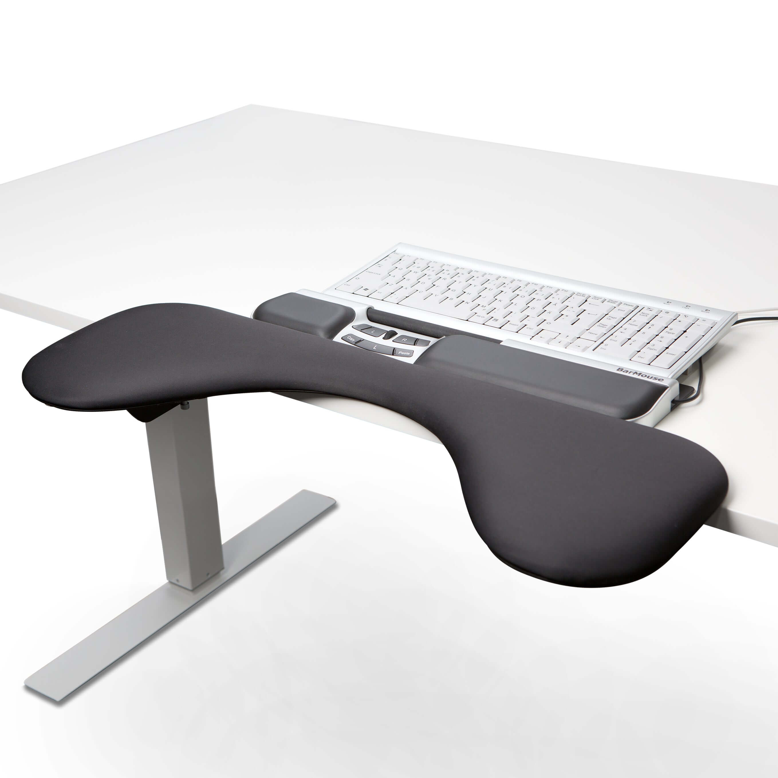 Ergonomic desk setup with BarMouse Silver Slim central mouse and thin wrist support next to a keyboard for optimal comfort.