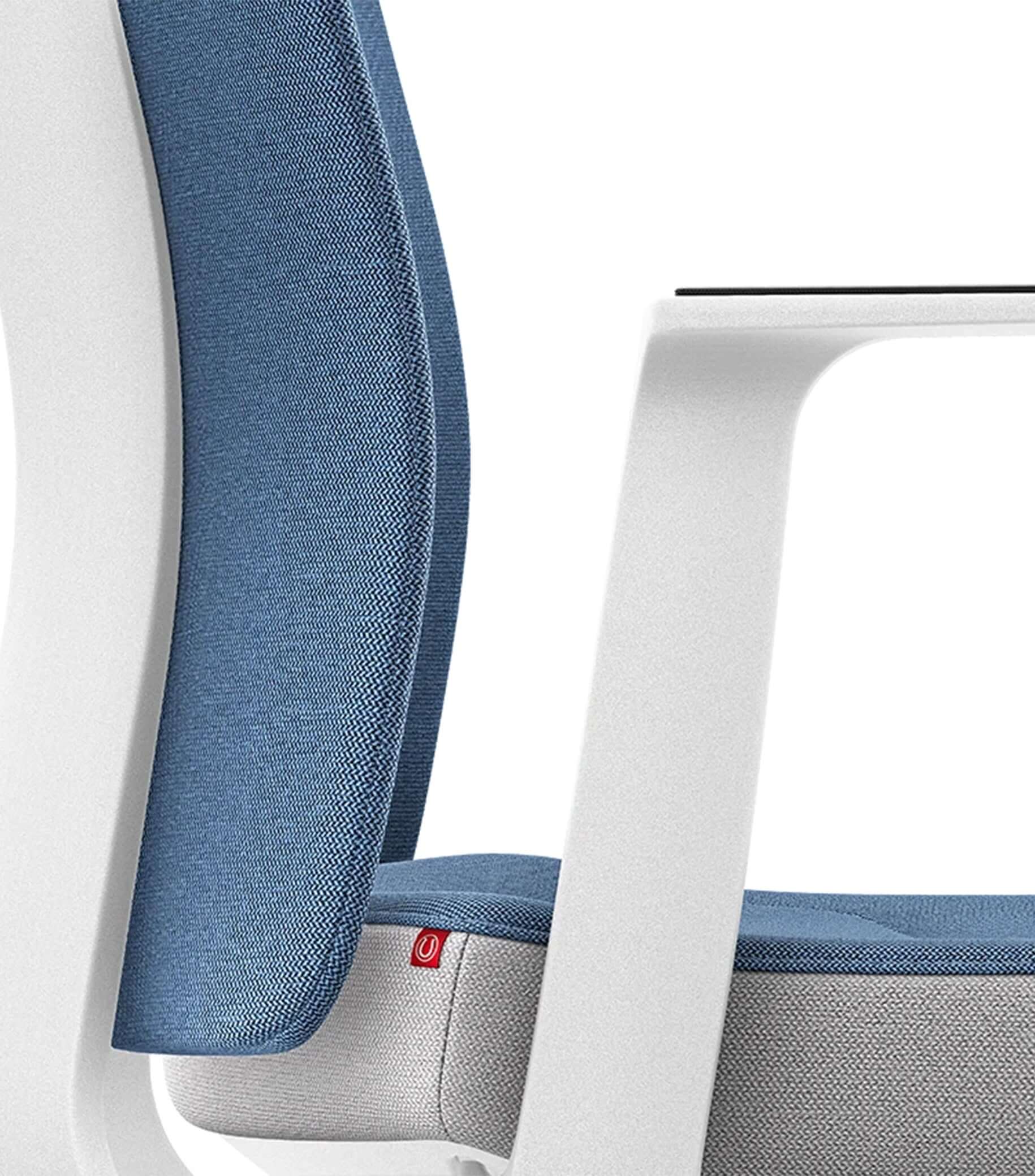Ergonomic chair with blue upholstery and padded backrest, featuring Smart-Spring technology for enhanced comfort and movement.