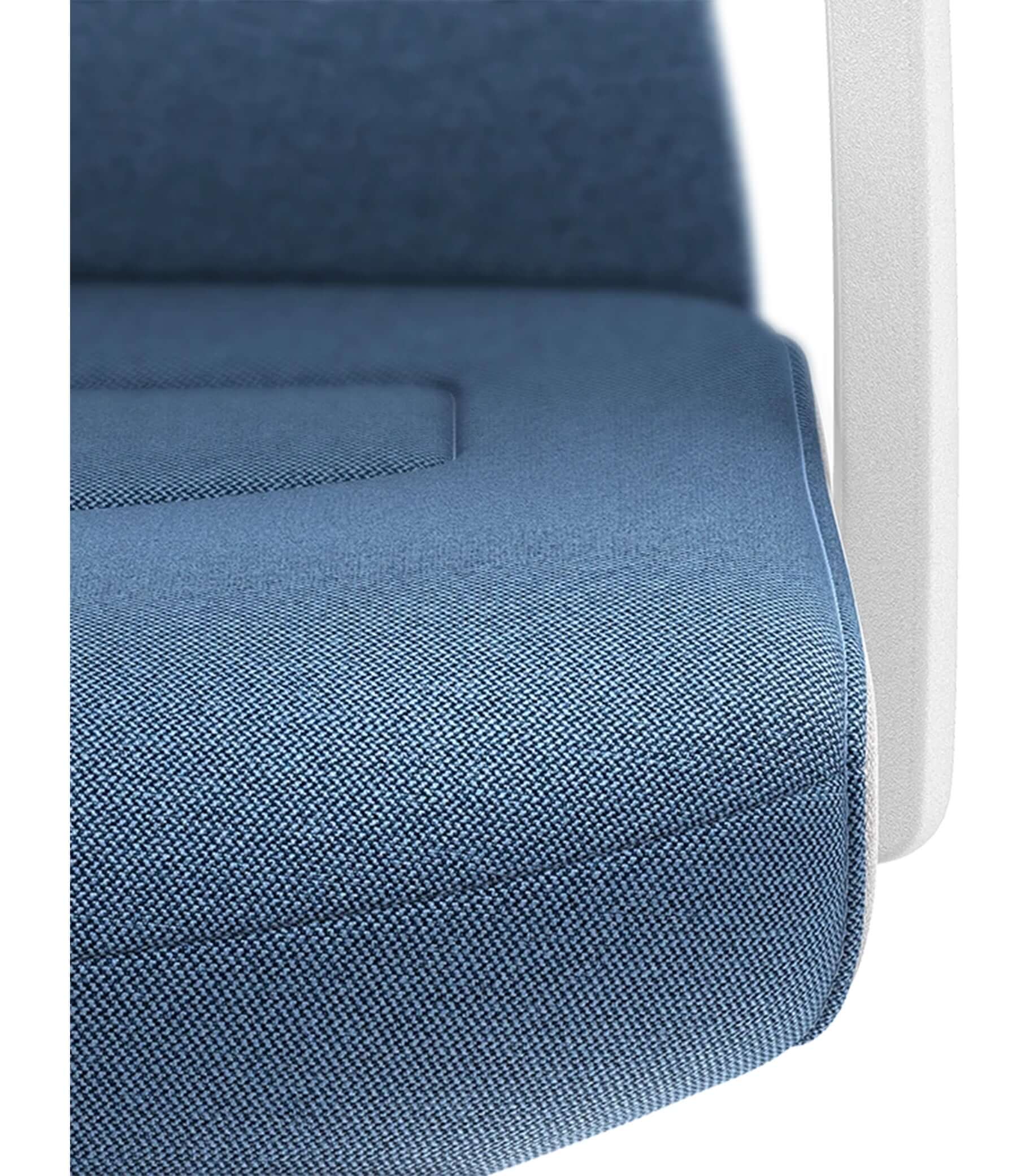 Close-up of PURE chair with padded backrest in white and Era blue upholstery, featuring ergonomic Smart-Spring technology.