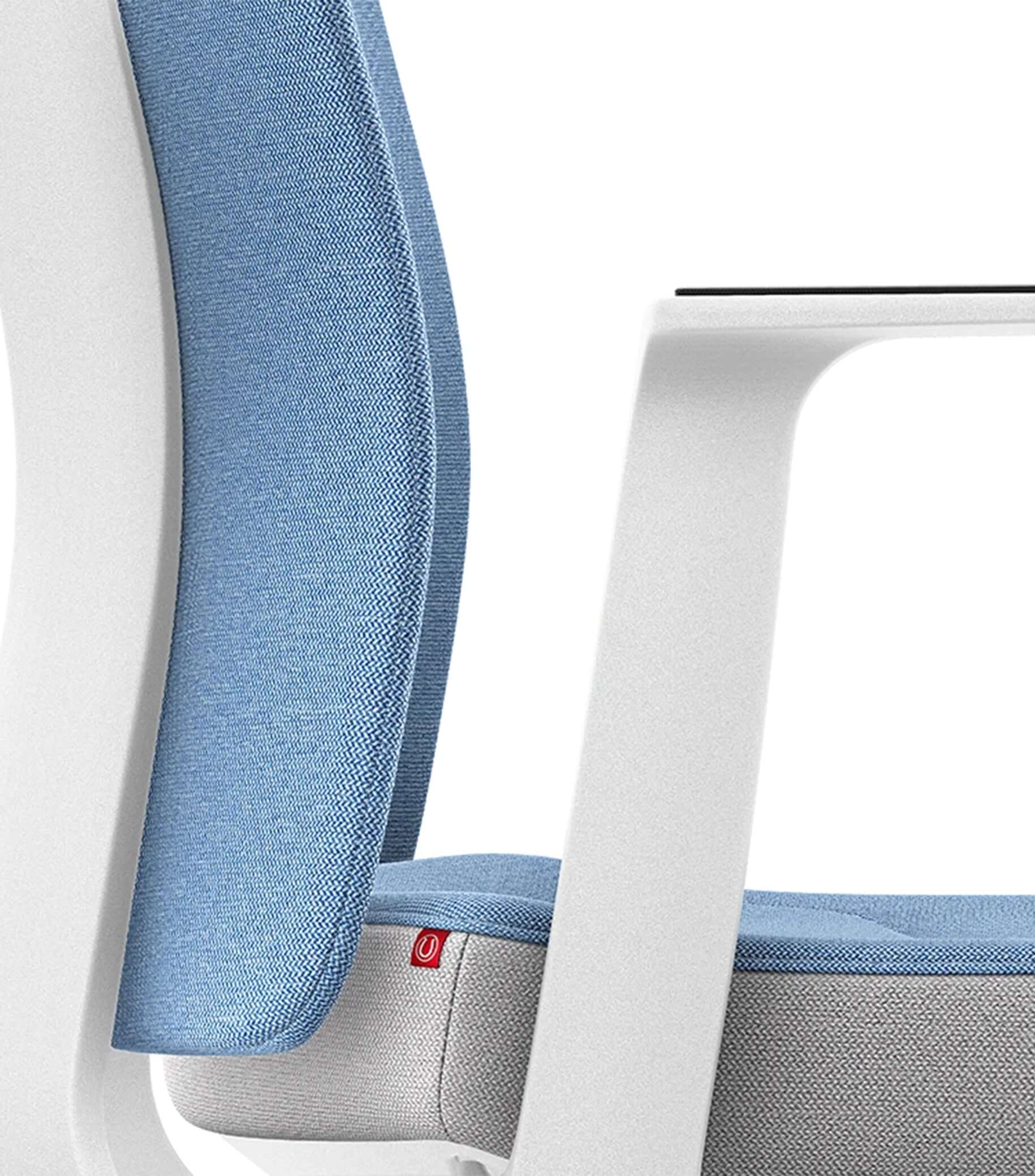 Ergonomic chair with Smart-Spring technology, blue padded backrest, white color scheme, promotes active sitting and spine mobilization.