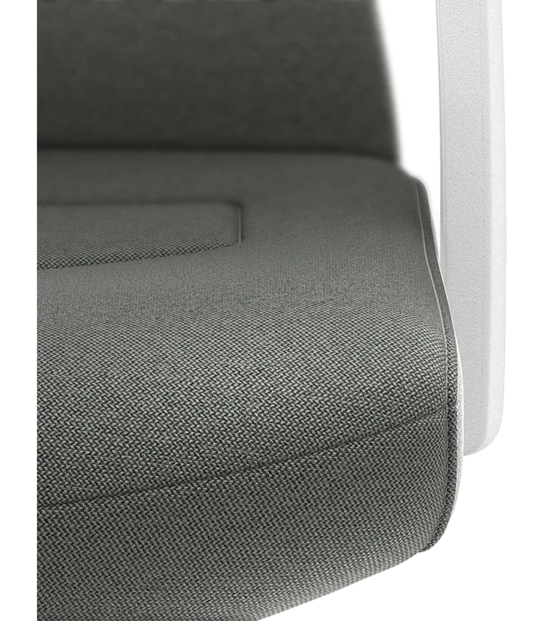 Close-up of PURE Interior Edition chair with grey Era upholstery and white padded backrest featuring Smart-Spring technology.