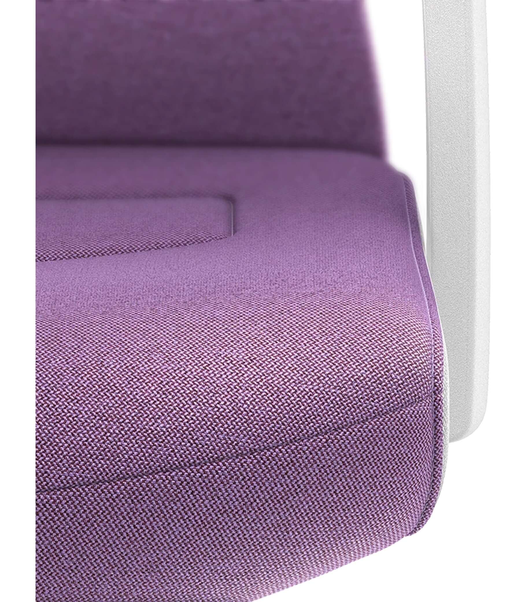 Close-up of padded purple seat with white armrest from PURE Interior Edition #10, featuring ergonomic Smart-Spring technology.