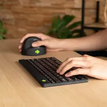 Ergonomic Ergo-R Black mini Bluetooth keyboard in use for comfortable typing, showcasing compact and user-friendly design.