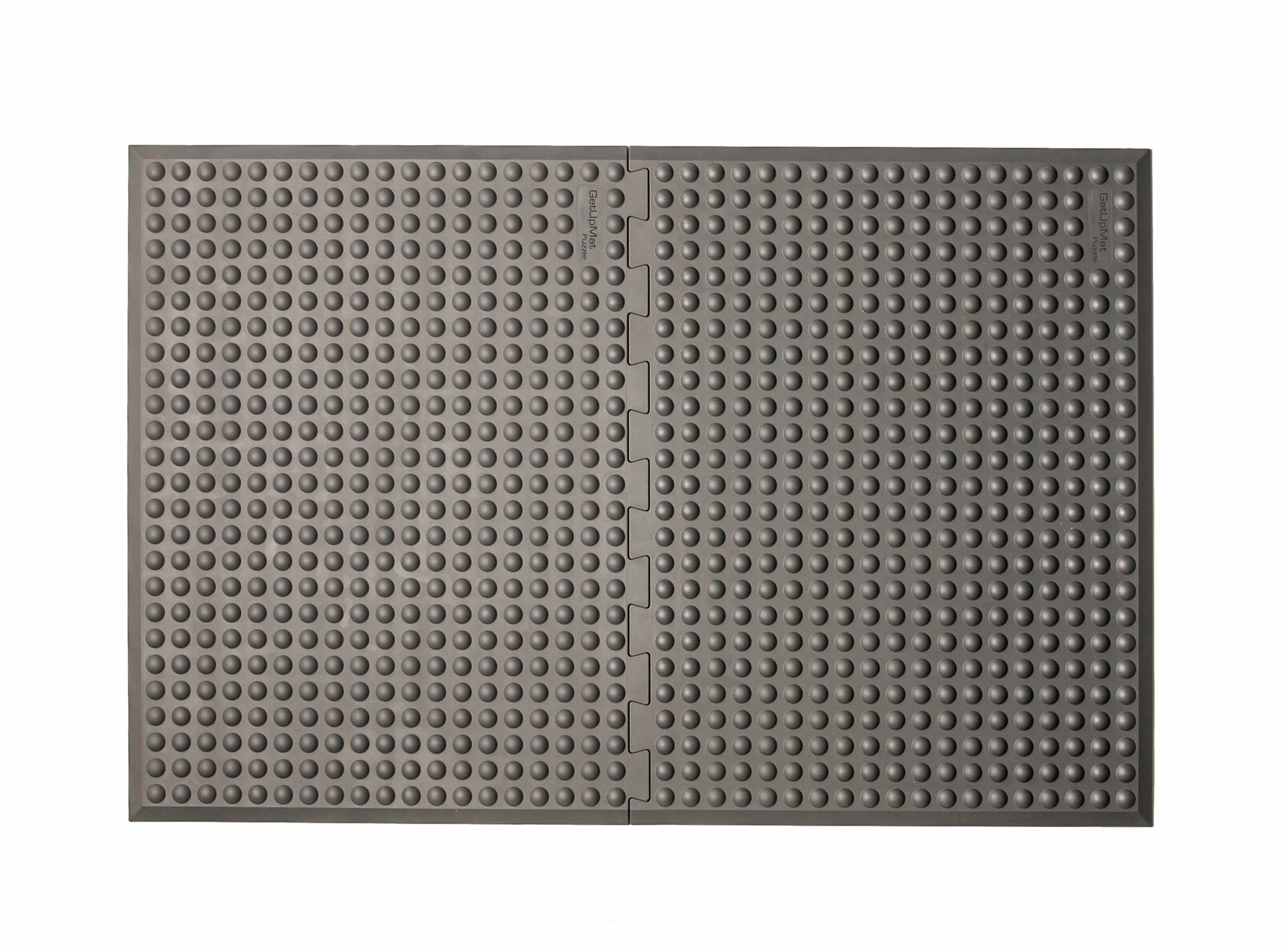 Grey GetUpMat Puzzle workstation mat for ergonomic standing, customizable length, ideal for reducing musculoskeletal strain.