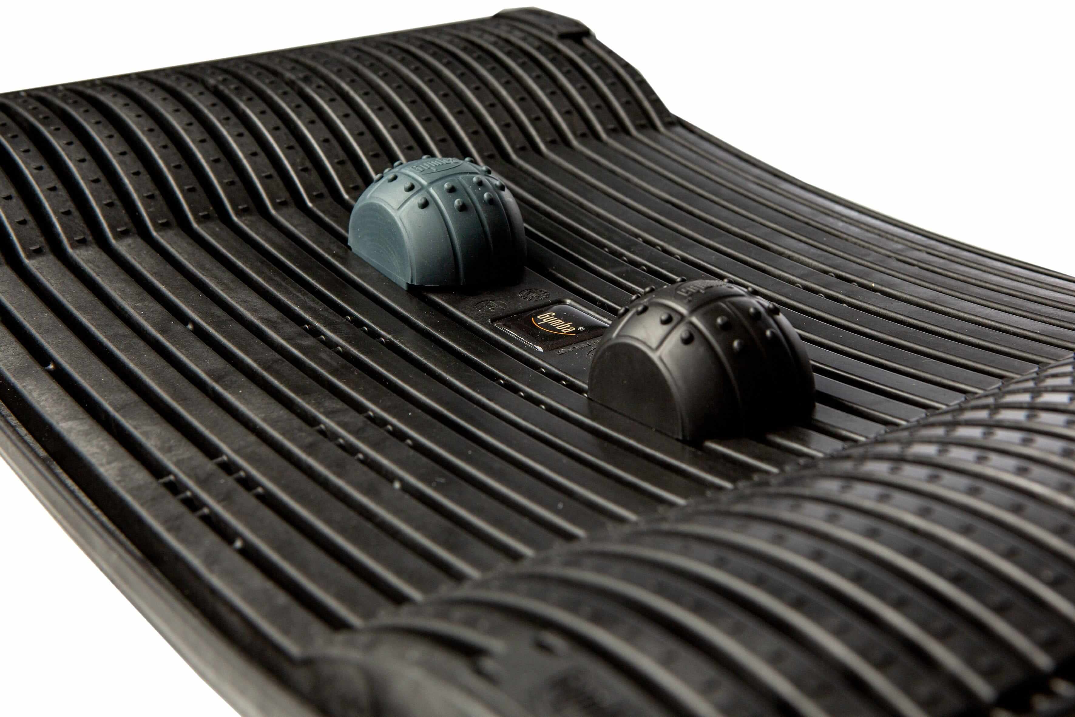Black Gymba activation board close-up showcasing textured surface and patented elasticity for workplace movement and health benefits.