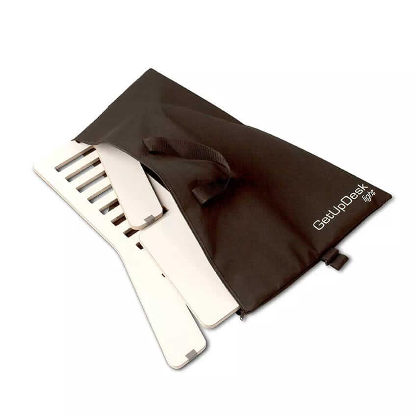 GetUpDesk Light carry bag in black with adjustable desktop and Gymba activation board, featuring handle and shoulder strap.
