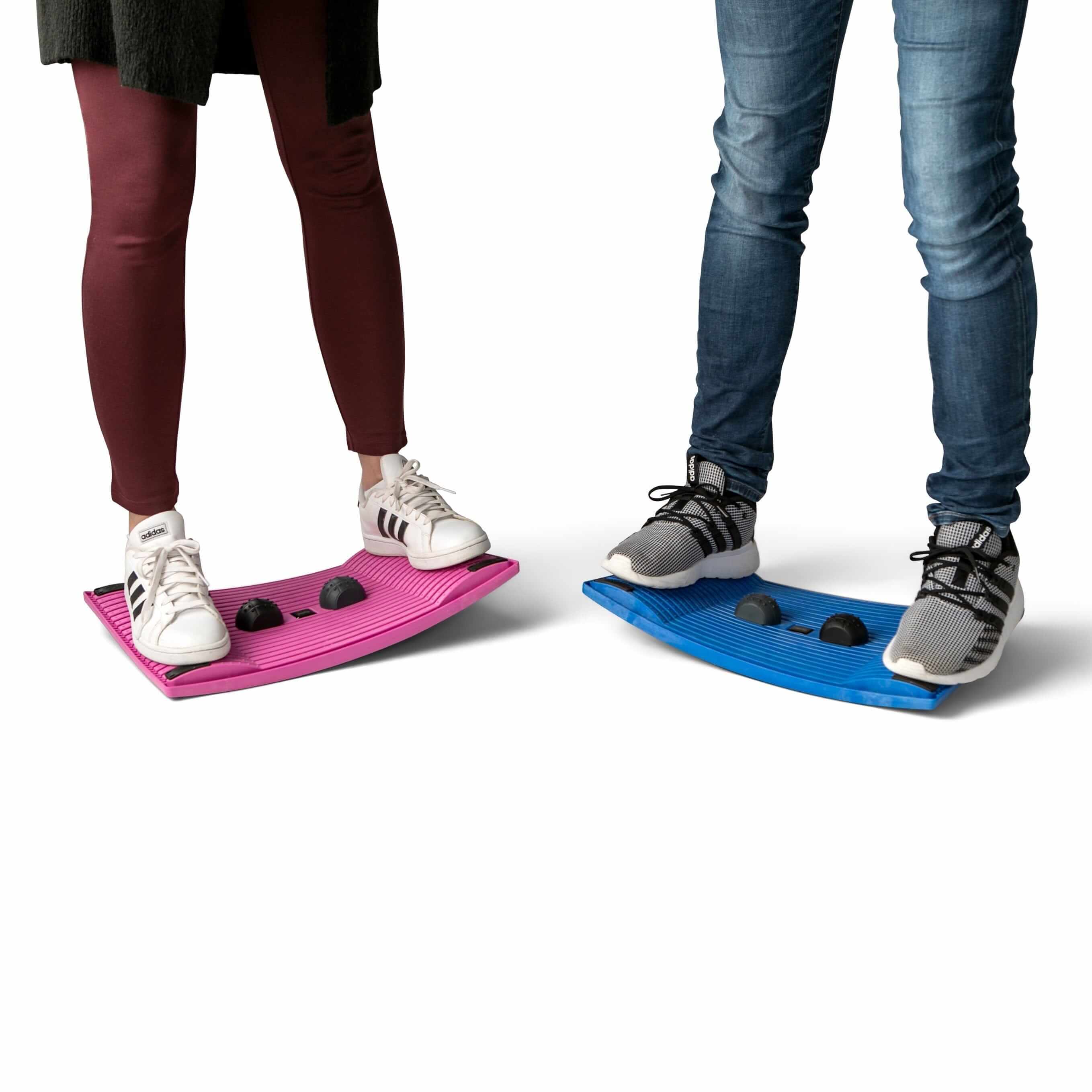 Two people standing on colorful activation boards for workplace movement and exercise.