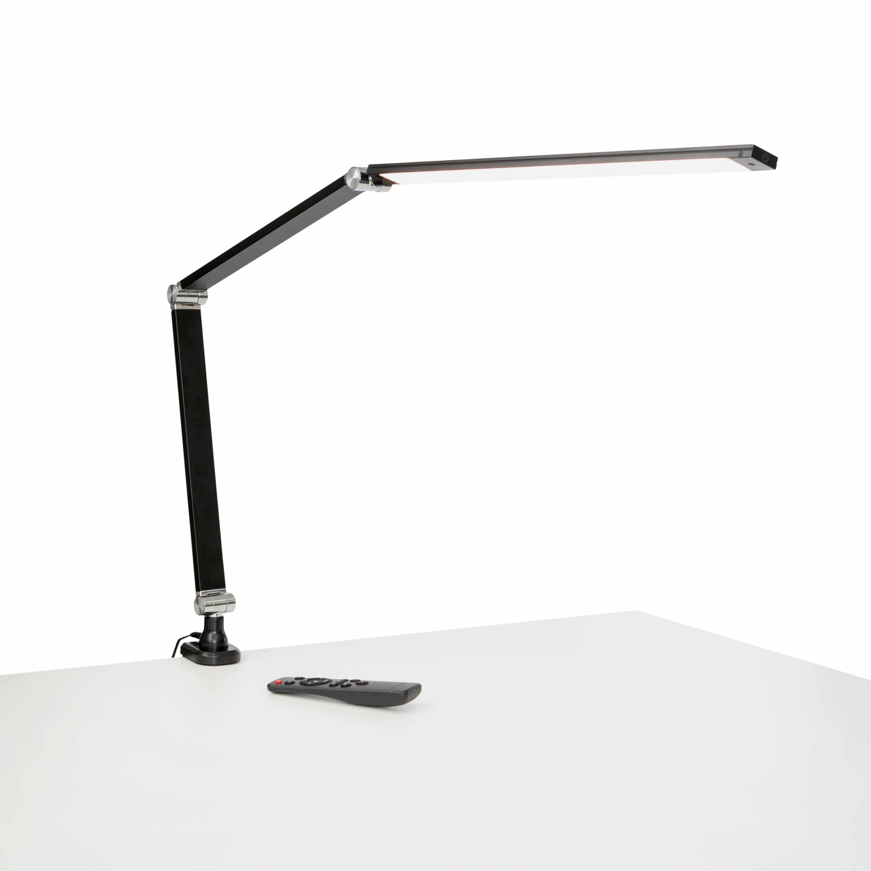 Black Link LED desk lamp with adjustable metal arm on a white desk.