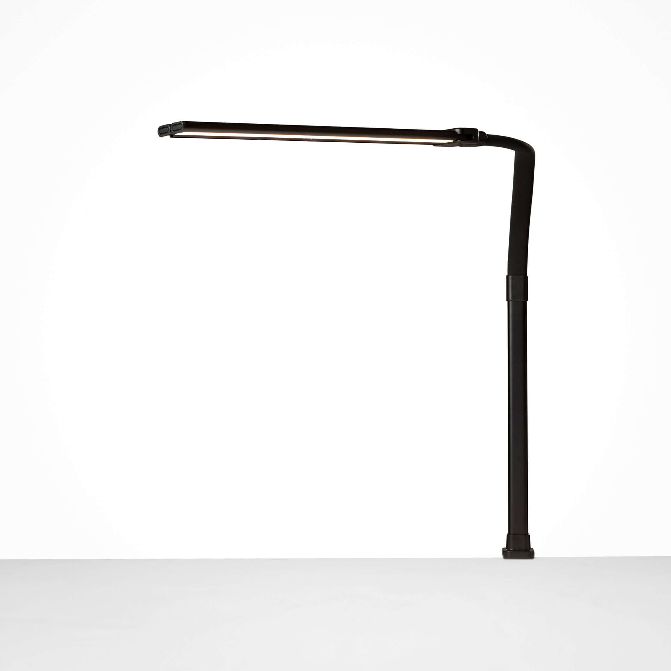 Black DUO LED desk lamp with adjustable dual light heads, ideal for customizable workspace lighting.