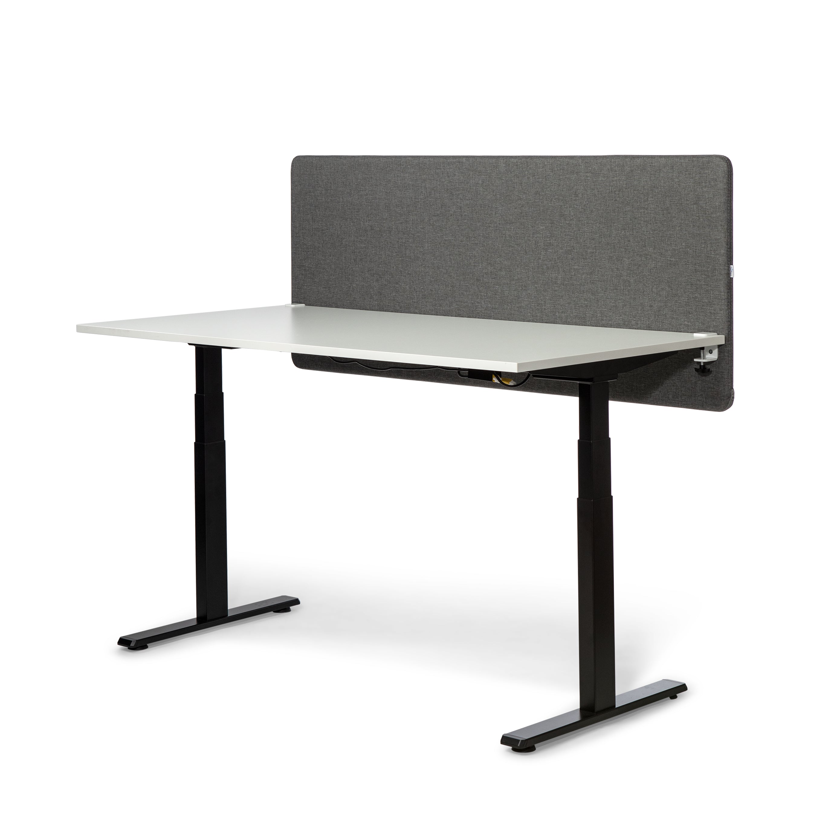 Grey soundproof screen mounted on a desk for improved privacy and focus in a workspace.