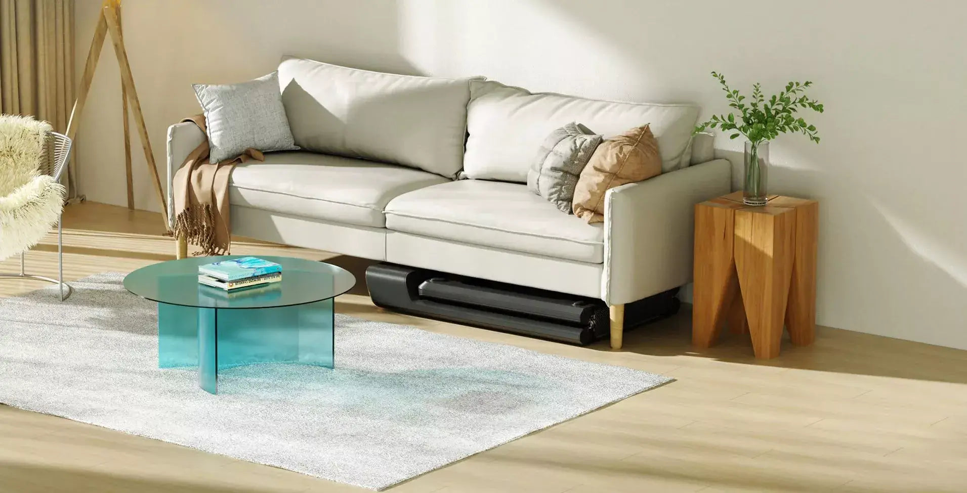 Compact WalkingPad Pro treadmill stored neatly under modern sofa in stylish living room setting.