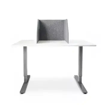 Foldable grey polyester screen guard on a white desk for enhanced productivity and sound absorption in workspaces.