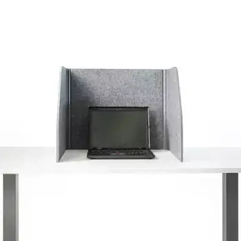 Foldable grey table screen with sound-absorbing fabric used on desk with laptop, enhancing work privacy and noise reduction.