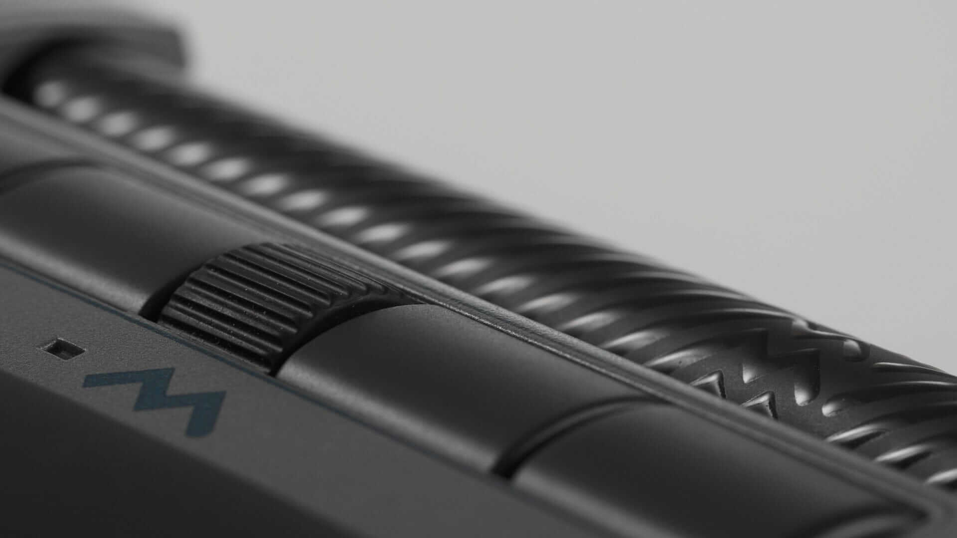 Close-up of Delta Regular black control bar with programmable buttons and textured grip designed for precision and customization.