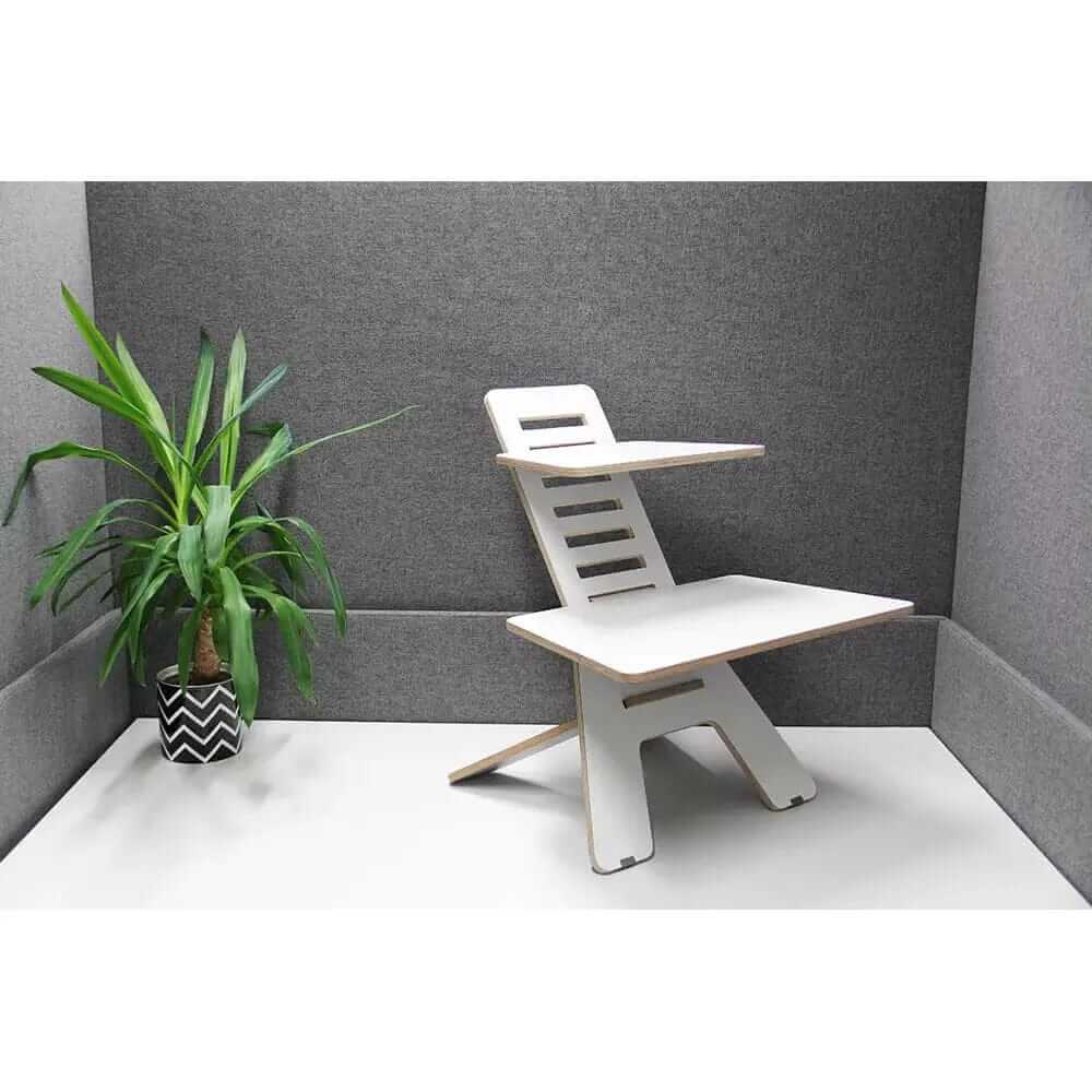 Ergonomic GetUpDesk Light laptop stand with additional shelf in a modern office setting.