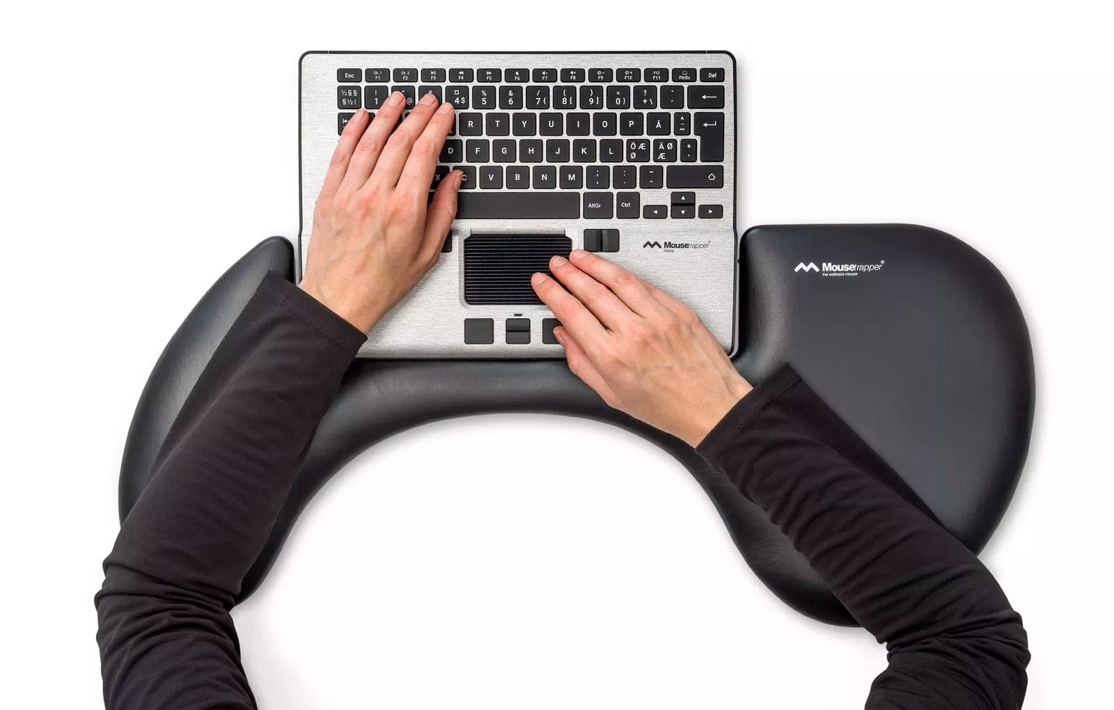 Person using Arm Support Alpha Nordic with keyboard, promoting ergonomic posture to prevent carpal tunnel and strain injuries.